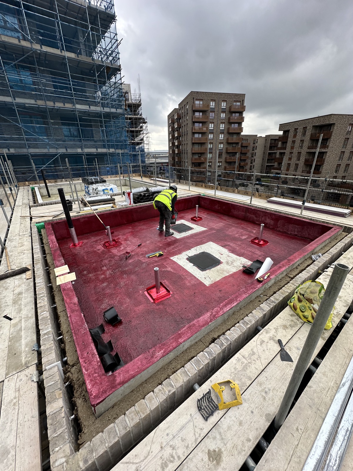 Waterproofing preparation work photographed on site.