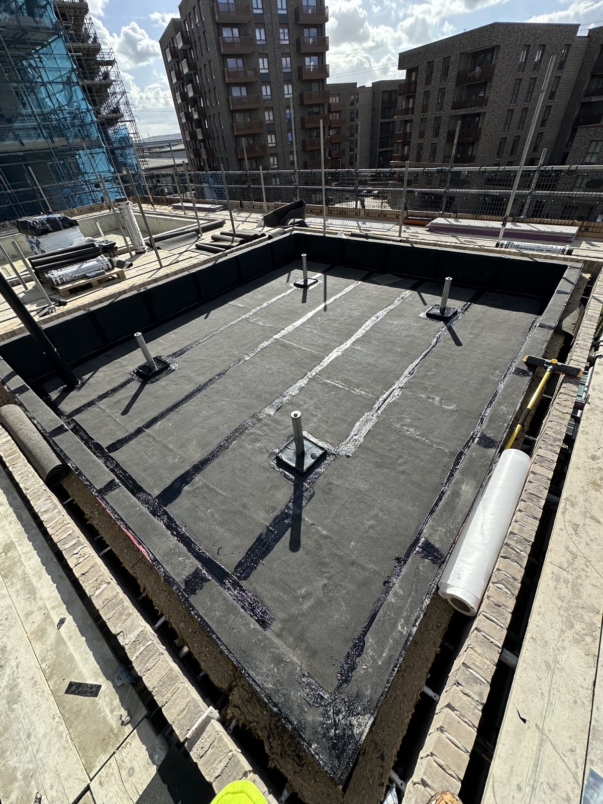 Hot melt waterproofing work photographed on site.