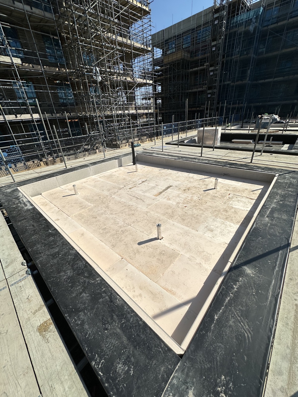 During stage of insulation & stone finish work.