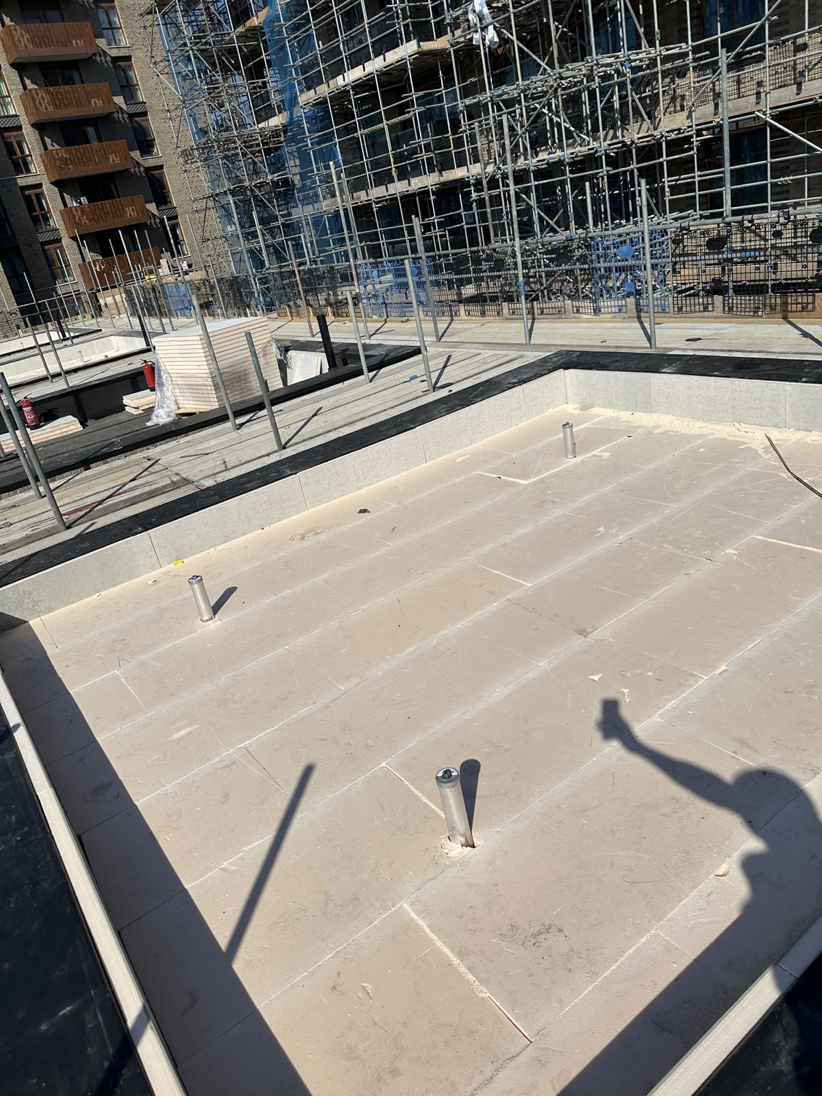 Completed stone finish around flat roof details.